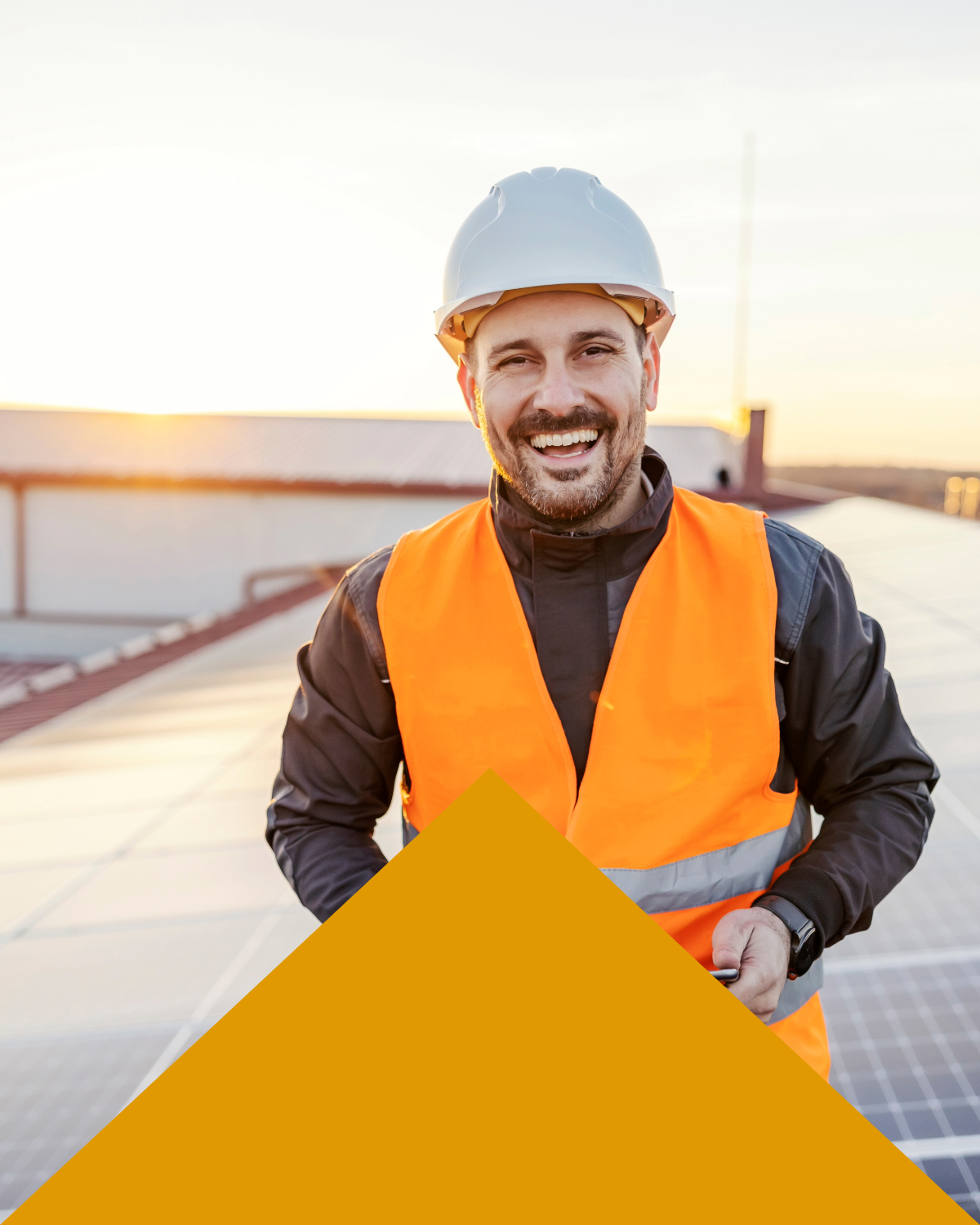 engineer smiling in a solar panel field 